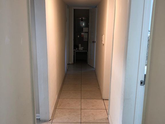 Hallway , A/C access door at the end of the hallway.