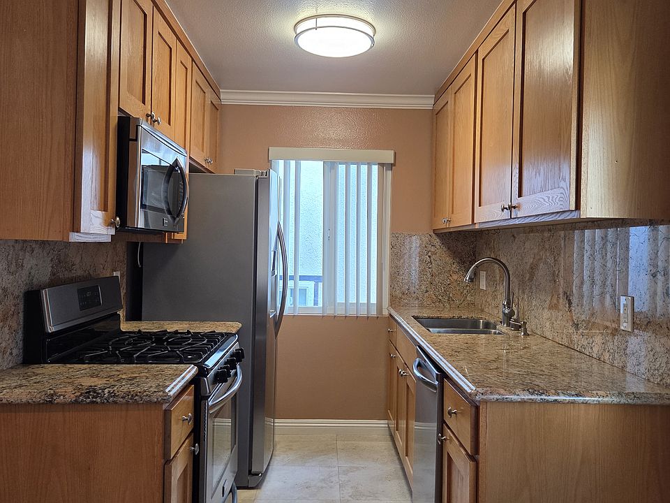 Custom kitchen with stainless appliances and granite counters
