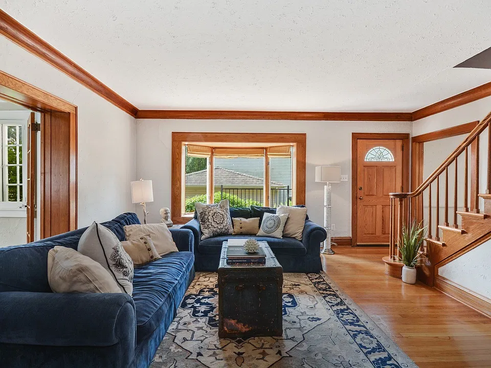 Family room with opposing view of foyer and front entry