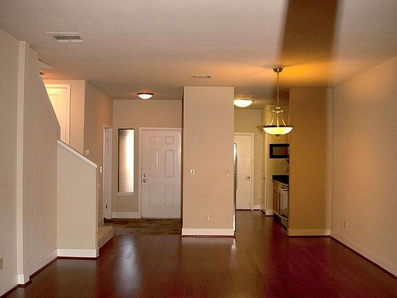 View from Living/Dining Room to Kitchen and Entry Door