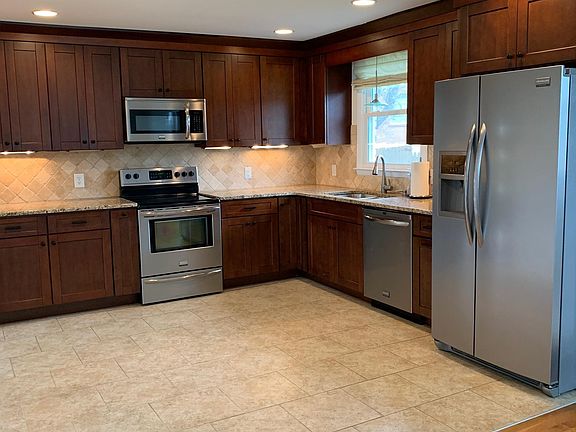 Updated Kitchen with tile floors, granite countertops, stainless steel appliances