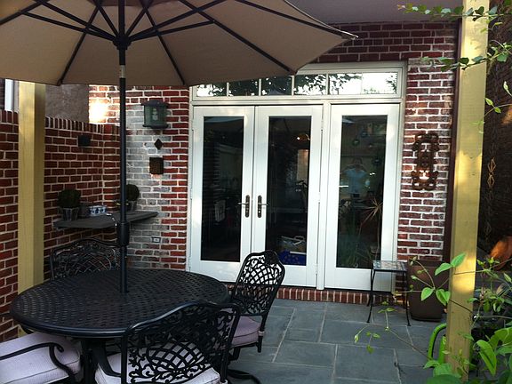 French doors open to garden oasis