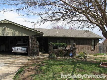 House front
						:
						Shade garden under tree, concrete drive thru to backyard on side of garage.