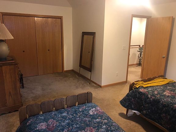 Second floor north bedroom showing hallway and very large closet.