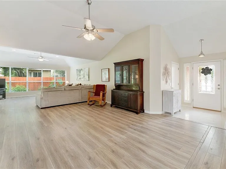 Large living room with lots of windows for natural light.