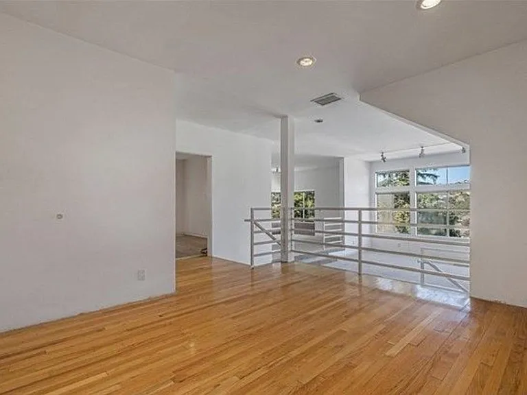 Mail living area with dining/living/kitchen entry and family room