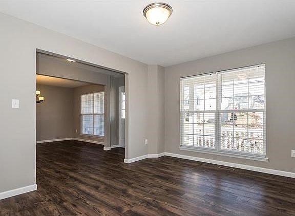 Main Floor Office is bright.  Two large windows give view to the front yard.