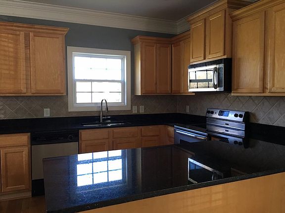 Kitchen with stainless steel appliances and granite countert