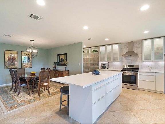 Kitchen open to dining area; perfect for entertaining.