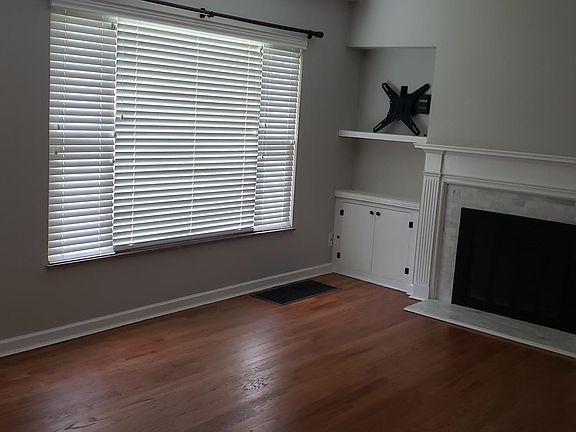 Living room with decorative fireplace