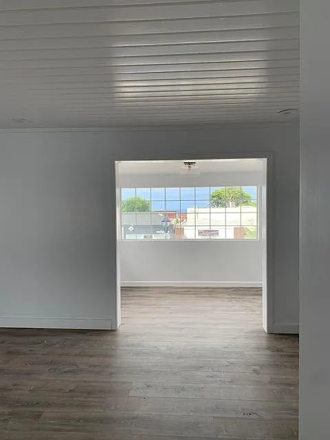 Main living area in fore-ground and dinning area beyond