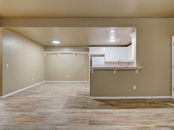 Porcelain tile is all new through out unit. Two of the three bedrooms have carpet.......and yes it is new also.