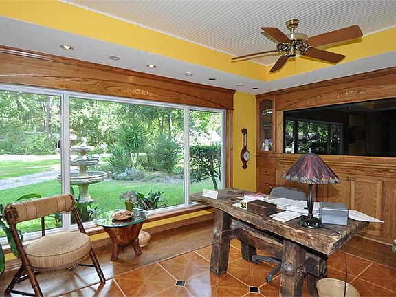 Private study just to the left as you enter....extensive custom wood flooring and custom woodwork  throughout the house.
