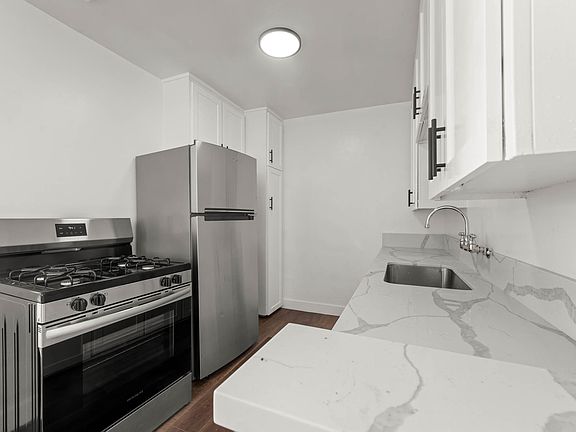 Kitchen includes the Stainless Steel Refrigerator, and Stove