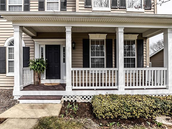 Covered front porch greets you!