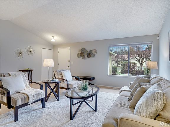 Welcome to your large and well appointed living room. Vaulted ceilings and natural light throughout. Entire Home has all new interior paint. Easy to clean and care for laminate flooring throughout. 