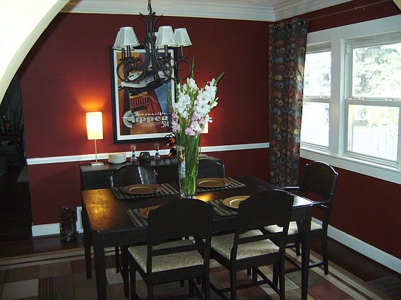 Dining room that has large windows and custom crown moulding