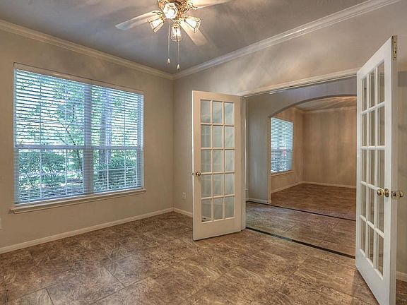 Crown molding and French doors dress up the study.