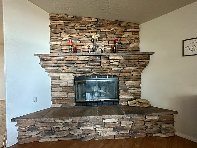 Large stone fireplace in living room