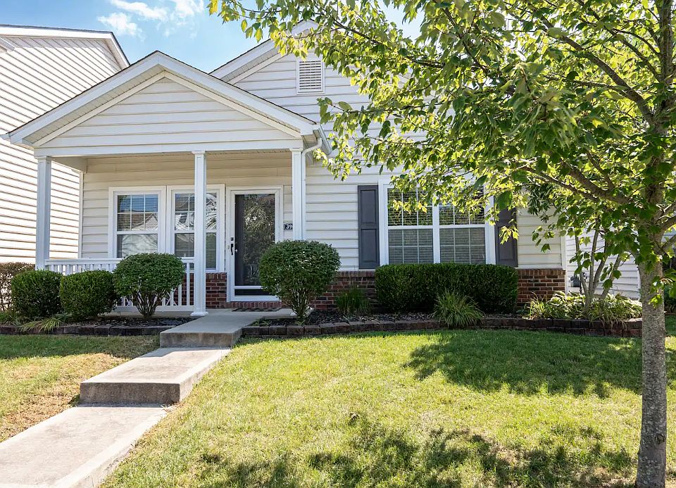 Front exterior. Three small steps from the curb. Covered porch.