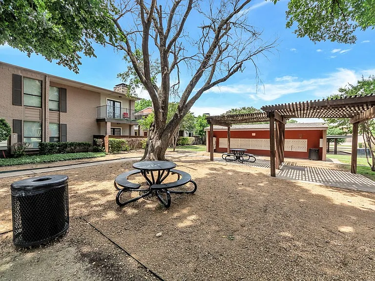 Outdoor picnic and grilling area with seating - perfect for gatherings and enjoying the outdoors.