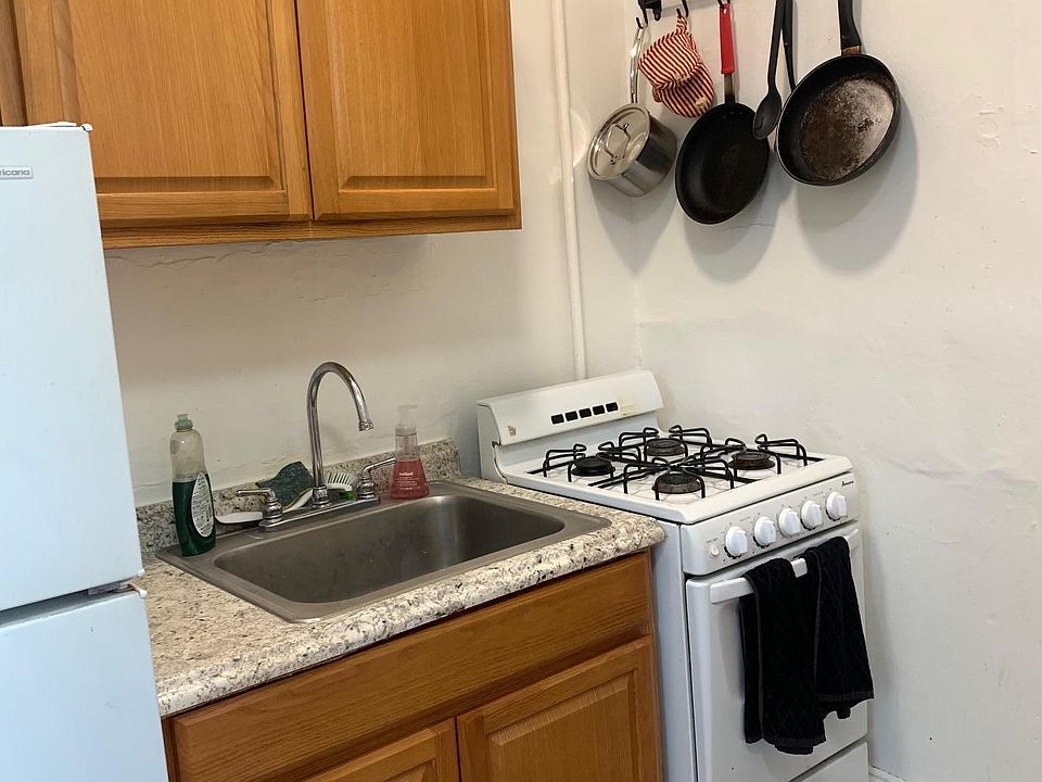 full size fridge, solid wood cabinets, stainless steel sink and perfect stove make this kitchen a pleasure
