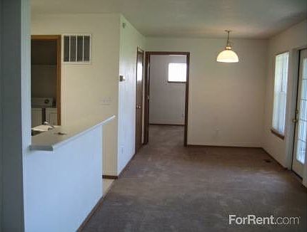 Entryway to kitchen, front, dining to bedrooms