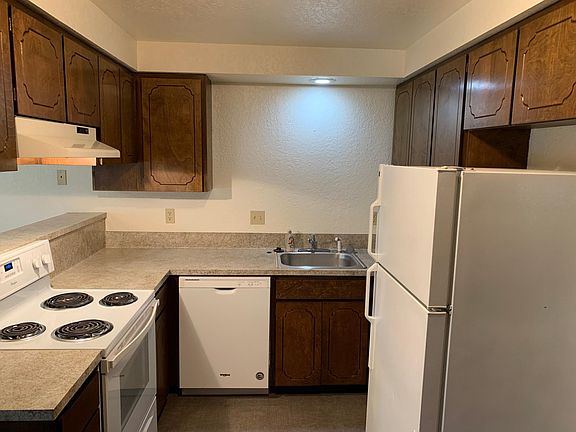 Refinished countertops newer appliances & refinished kitchen cabinets!