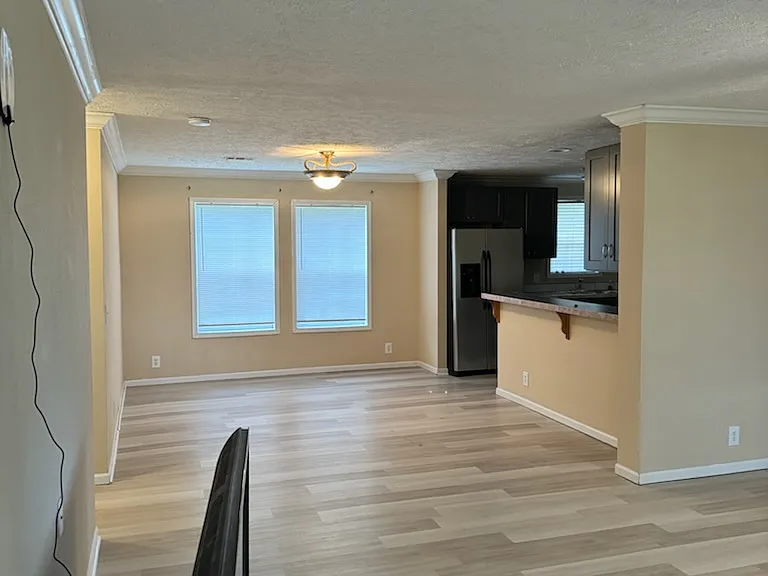 Dining room from living room, large screen tv in foreground