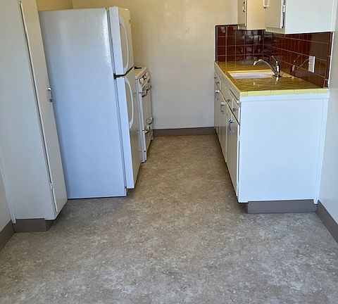 Wedgewood stove beyond refrigerator