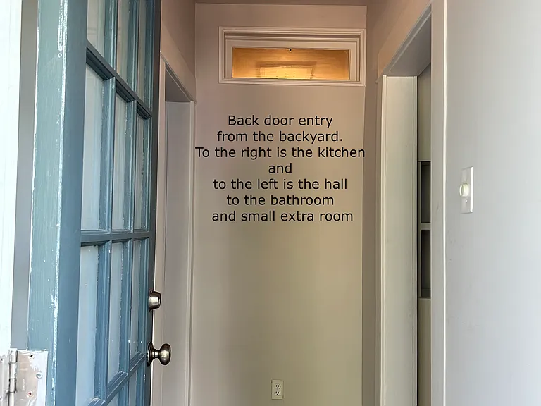 this is the back entry hall. To the right is the kitchen and to the left is the hall to the bathroom and small 8x8 extra room.