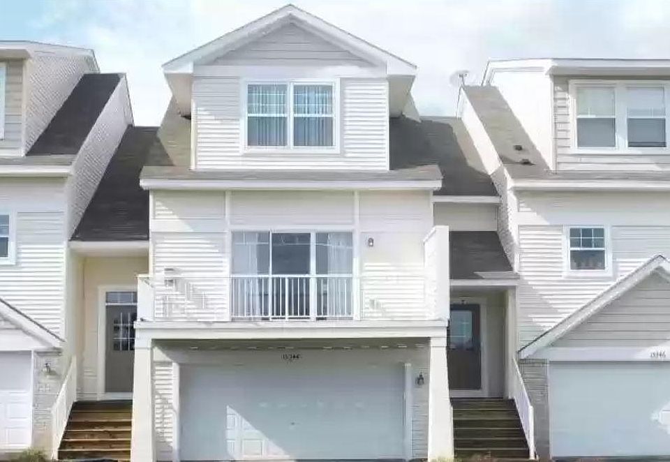 Row townhome with deck with front and back windows, lots of natural light.