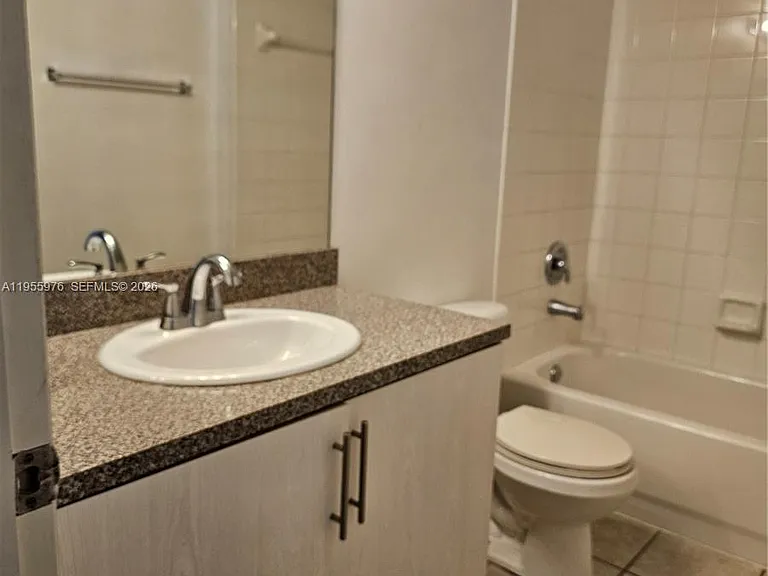 5011 Wiles Rd #306 — Photo 11