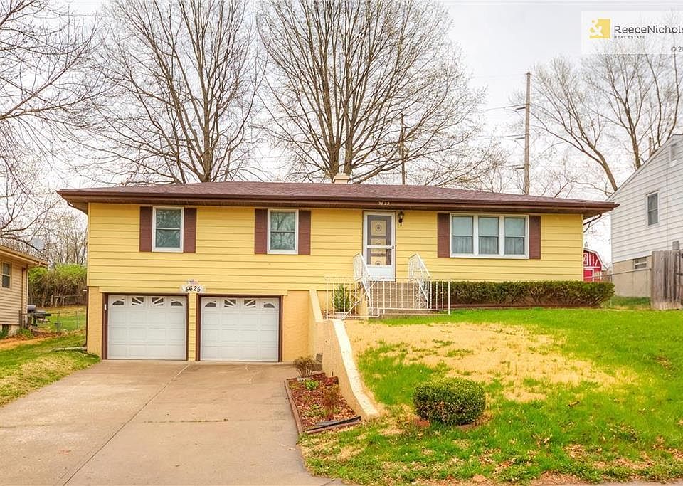 RAISED RANCH WITH TWO CAR GARAGE