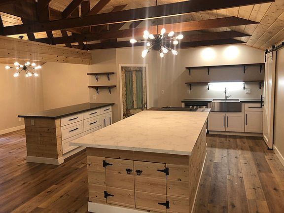 Kitchen and pantry. Barn door leads to main bath and laundry