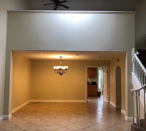 View from the entry - Formal Dining Room or entertainment area and upstairs Loft (2nd Floor). Whole house was recently painted (walls, ceilings and baseboards).