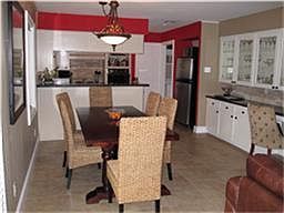 View looking into the informal dining area and kitchen beyond- great entertainment apace very open concept excellent for today's living style