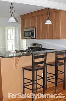 Bar level kitchen counter
						:
						opens to family room