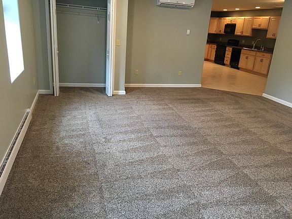 Living room showing the large coat closet