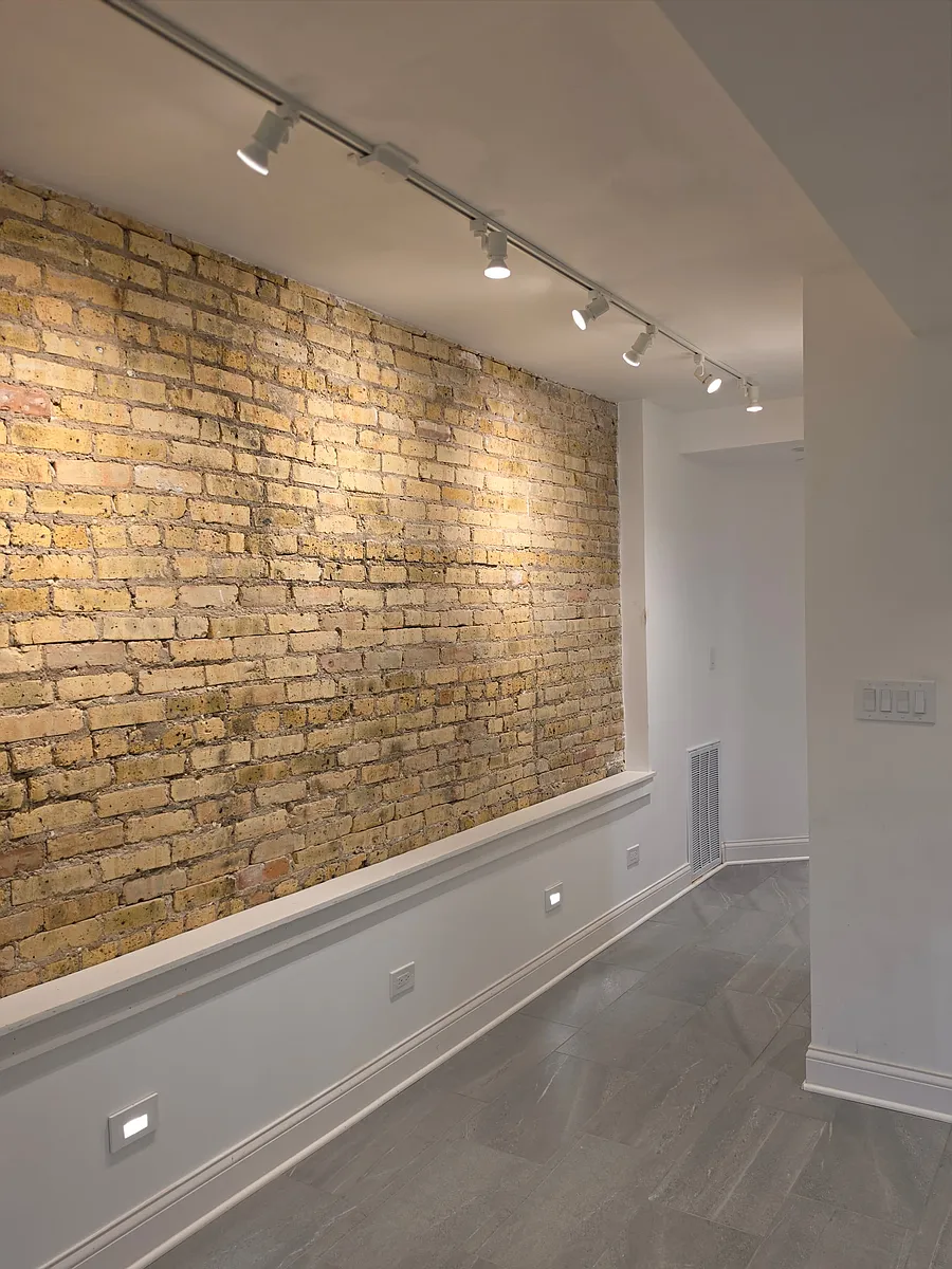 Loft like exposed brick walls with adjustable track lighting for your art work - 1046 N Spaulding Ave #G