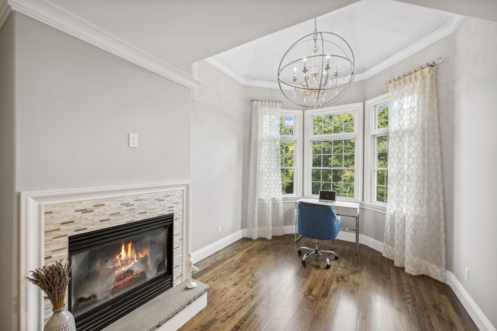  Gas Fireplace and Sitting Area in Primary Suite