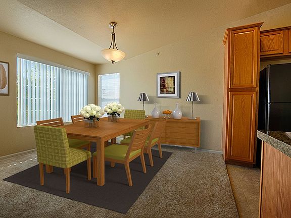 Spacious dining area with plush carpeting.