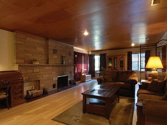 Through the front door is a great room anchored by a prominentflagstone hearth