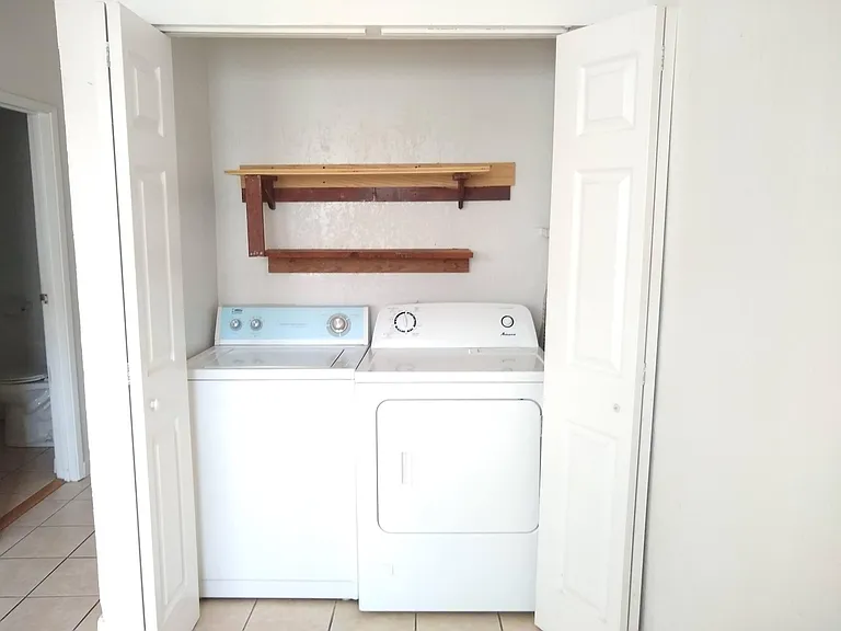 washer & dryer closet, located in kitchen