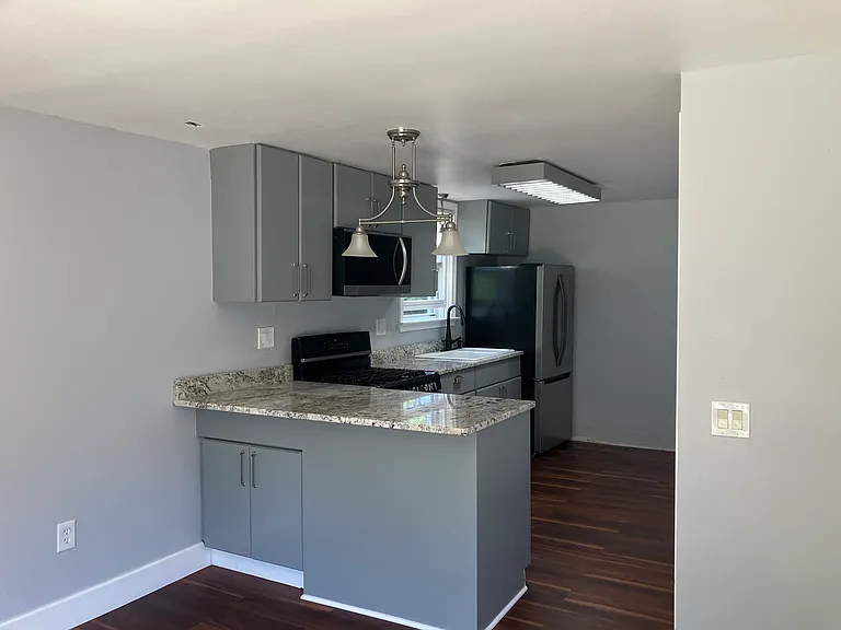 Granite breakfast bar with extra storage.