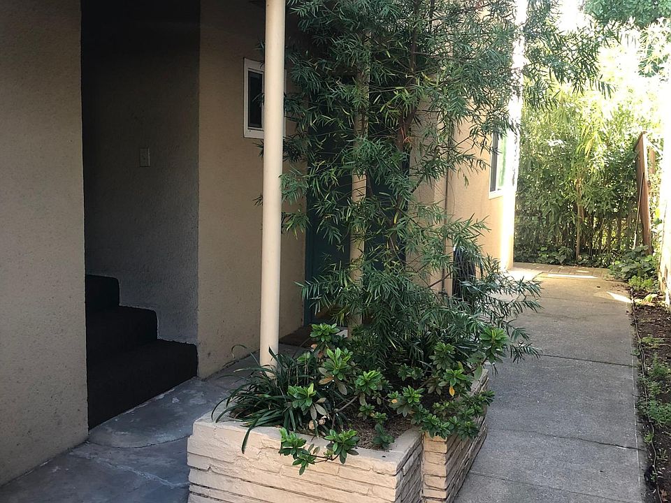 After walking through the carport, there is a 4 unit building. At the planter is a set of steps that takes you to Unit 3.