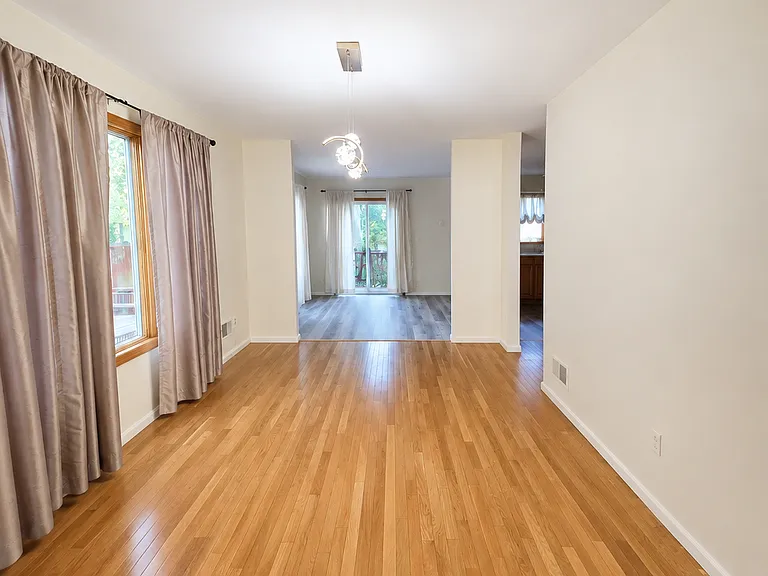 Spacious dining area with gleaming hardwood floors