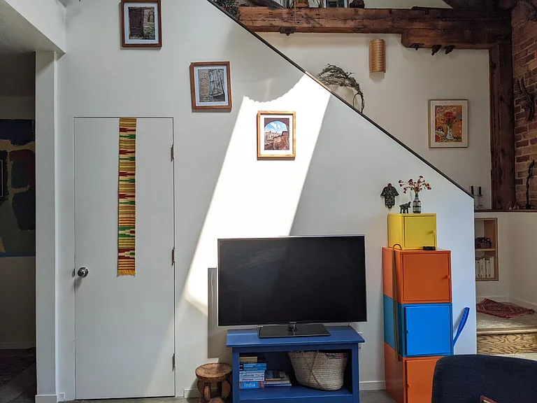 Television with Chromecast/Stairs up to the loft