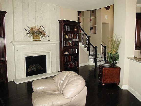 VIEW #1 OF THE FIRST FLOOR LIVING AREA - OPEN TO KITCHEN & BREAKFAST