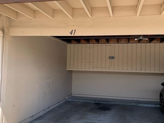 Covered carport with storage space with lock
